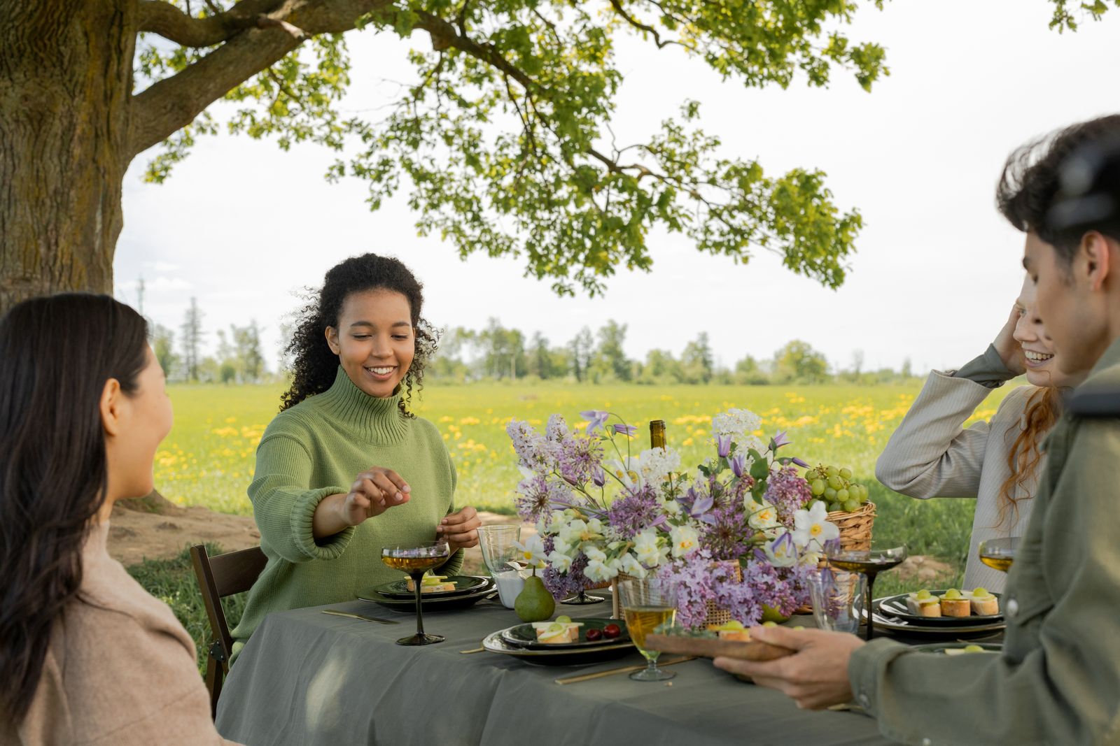Friends sharing food and conversation outdoors